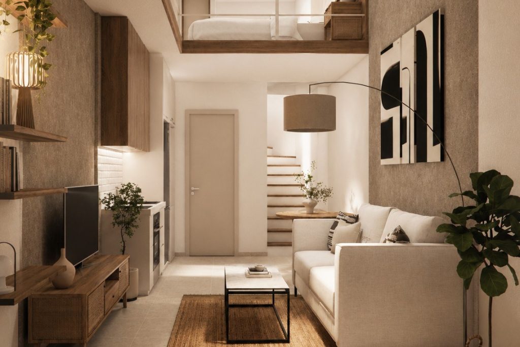 Living area of the loft apartment with the mezzanine and staircase